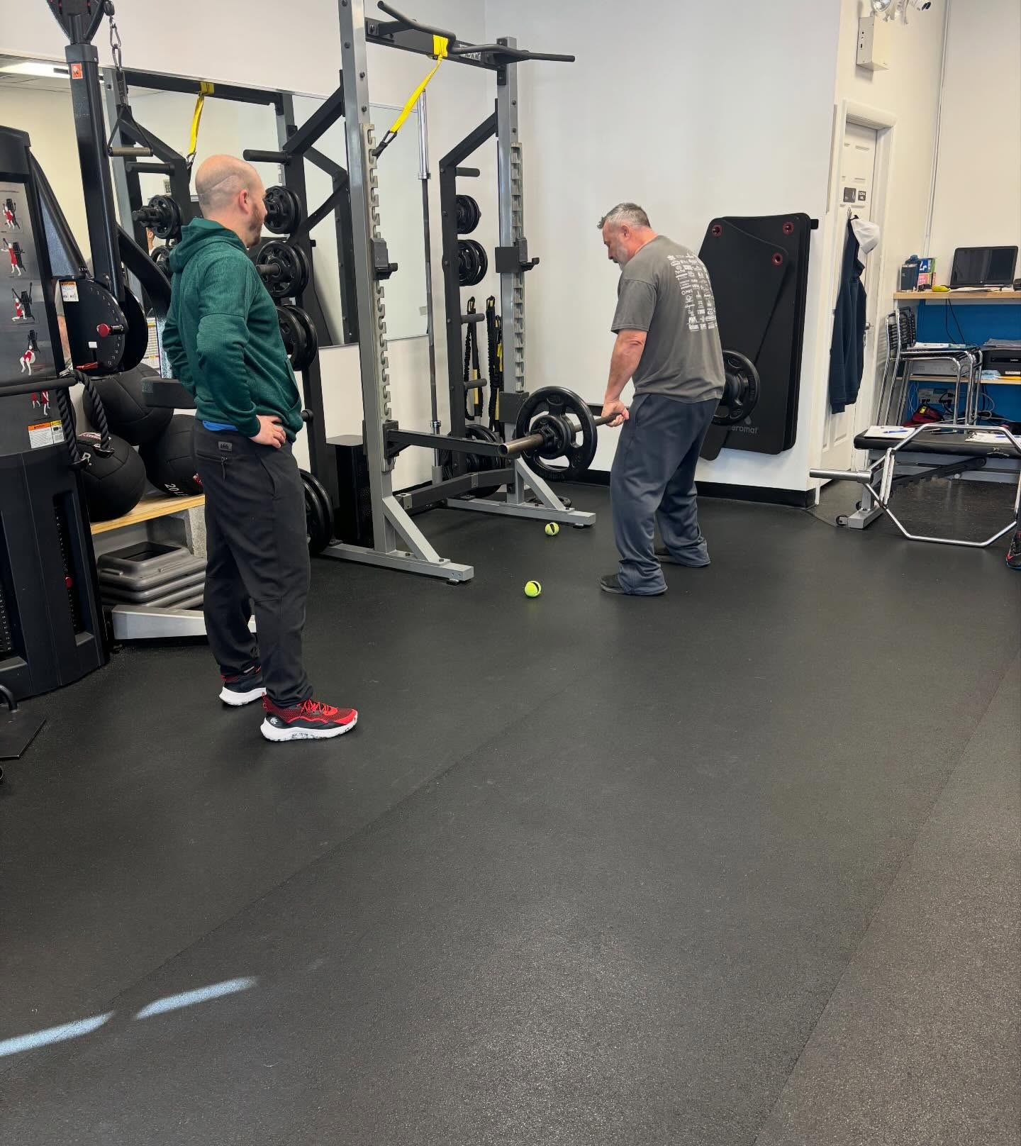 Coach working with a member